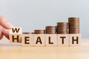 Hand,Flip,Wooden,Cube,With,Word,Wealth,To,Health,With